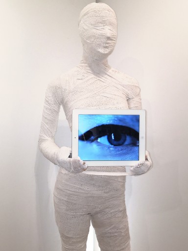 Picture of the life-sized mummy sculpture with video art at The Untitled Space